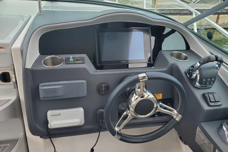 Loml Yacht Photos Pics 2020 Regal 33 Express helm with Garmin display and modern controls.