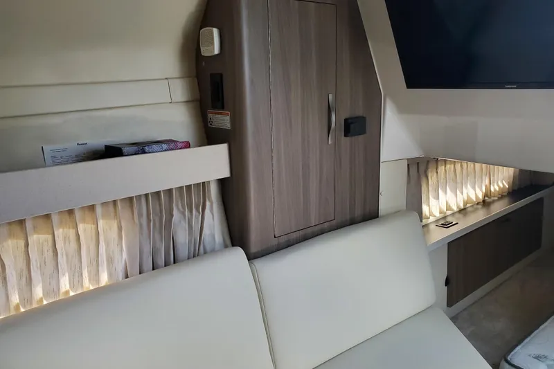 Loml Yacht Photos Pics 2020 Regal 33 Express interior with modern cabinetry and ambient lighting.