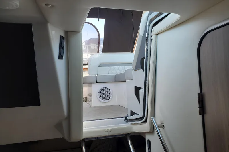 Loml Yacht Photos Pics Interior view of 2020 Regal 33 Express boat, featuring seating and modern design.