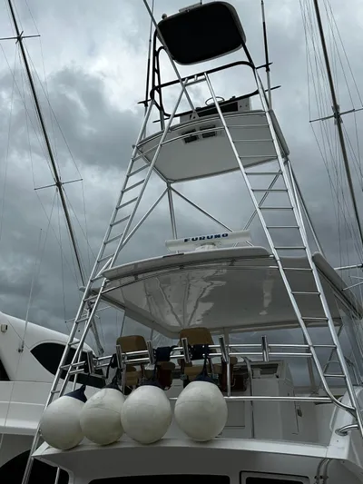  Yacht Photos Pics 2003 Viking 52 yacht with tower and cloudy sky background.