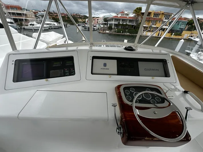  Yacht Photos Pics Helm of 2003 Viking 52 yacht with Garmin navigation system, docked in marina.