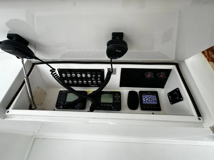  Yacht Photos Pics Control panel of a 2003 Viking 52 boat with communication and navigation equipment.