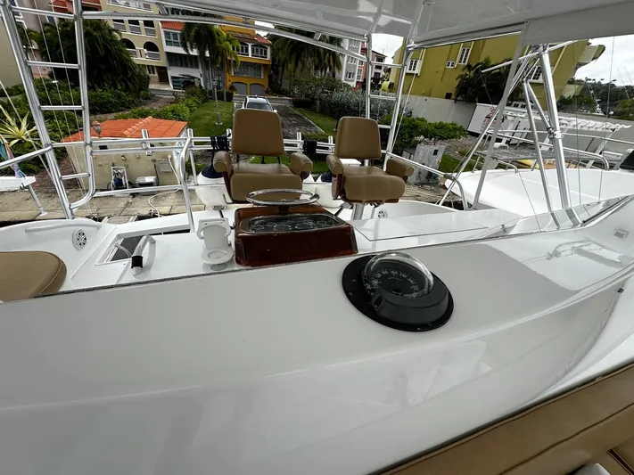  Yacht Photos Pics Flybridge of 2003 Viking 52 yacht with helm chairs and navigation equipment.