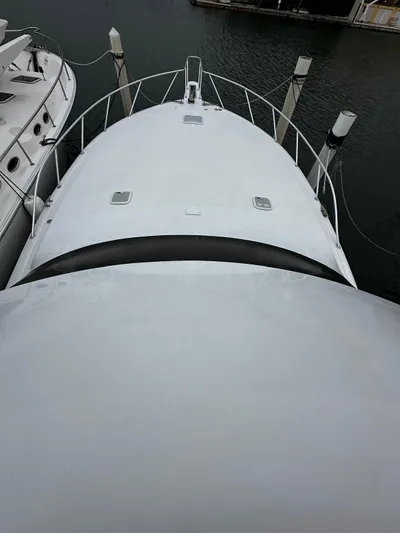  Yacht Photos Pics 2003 Viking 52 yacht docked, aerial view of bow and deck.