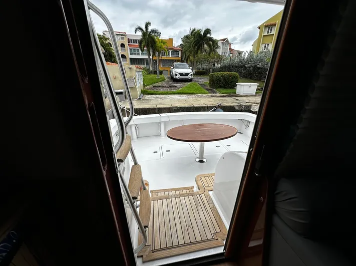  Yacht Photos Pics View from inside a 2003 Viking 52 yacht, showing deck and outdoor scenery.