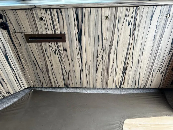  Yacht Photos Pics Wood-paneled interior of a 2003 Viking 52 boat, featuring sleek, modern design elements.