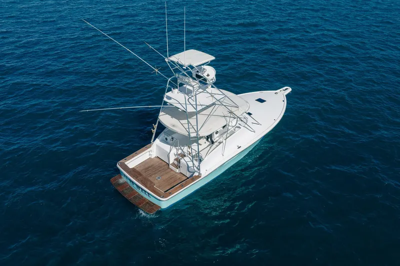 It Is Well Yacht Photos Pics Aerial view of 1997 Strike 42 Express yacht on open blue sea.