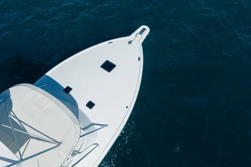 It Is Well Yacht Photos Pics Bow of 1997 Strike 42 Express boat on open water.