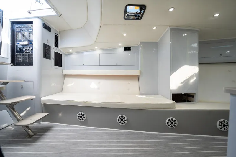 It Is Well Yacht Photos Pics Luxurious interior of 1997 Strike 42 Express yacht with modern seating and control panel.