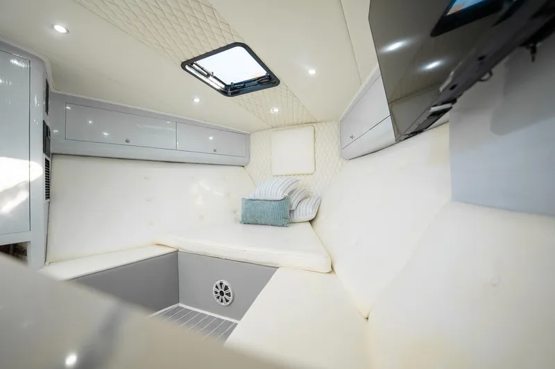 It Is Well Yacht Photos Pics Luxurious interior of 1997 Strike 42 Express boat with plush seating and modern amenities.