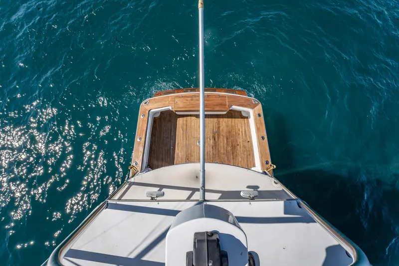 It Is Well Yacht Photos Pics Aerial view of 1997 Strike 42 Express boat deck on sparkling blue water.