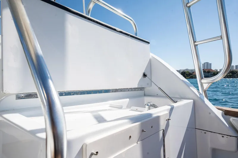 It Is Well Yacht Photos Pics 1997 Strike 42 Express boat deck with stainless steel railings and ocean view.