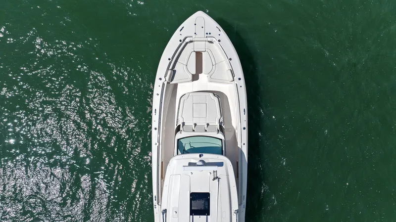  Yacht Photos Pics 2023 Grady-White Canyon 456 boat, aerial view on green water.