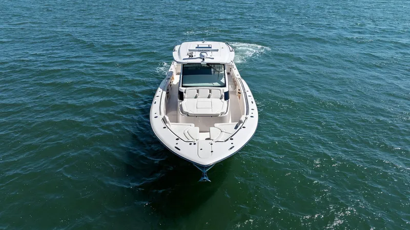  Yacht Photos Pics 2023 Grady-White Canyon 456 boat cruising on open water.