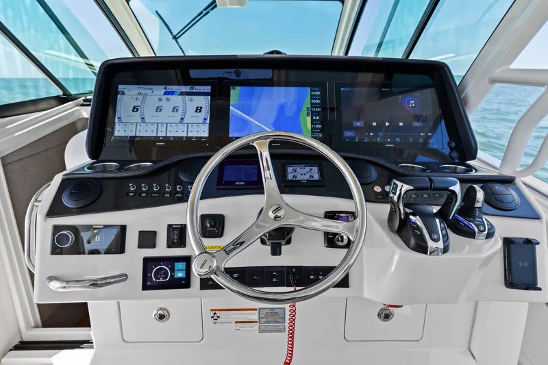  Yacht Photos Pics 2023 Grady-White Canyon 456 helm with advanced navigation and control systems.