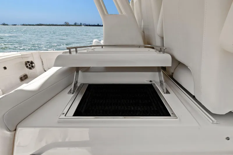  Yacht Photos Pics 2023 Grady-White Canyon 456 boat interior with open storage compartment.