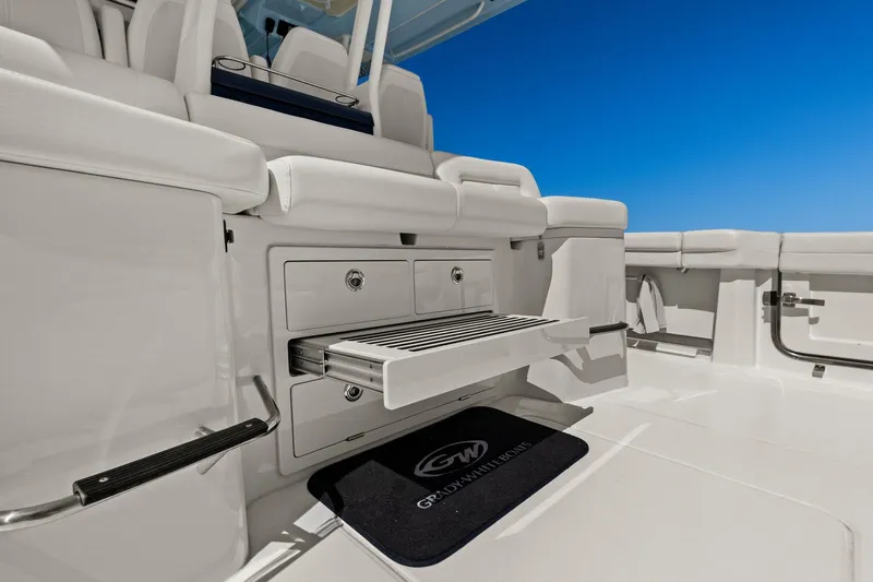  Yacht Photos Pics 2023 Grady-White Canyon 456 boat interior with seating and storage compartments.