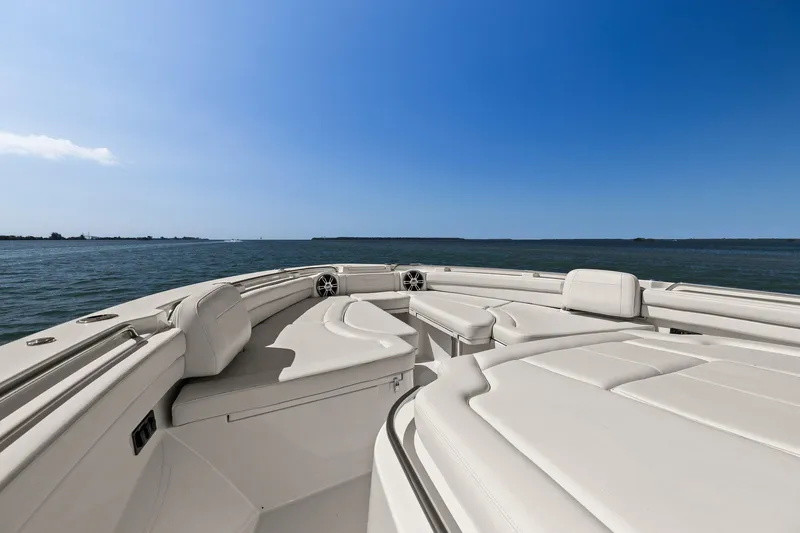  Yacht Photos Pics 2023 Grady-White Canyon 456 boat interior with ocean view under clear blue sky.