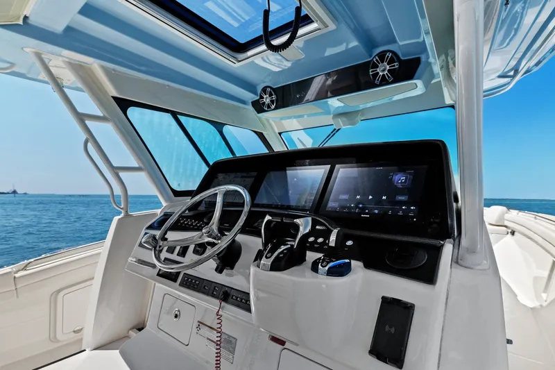  Yacht Photos Pics 2023 Grady-White Canyon 456 helm with modern controls and ocean view.