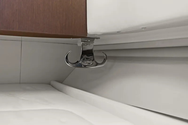  Yacht Photos Pics 2023 Grady-White Canyon 456 interior detail with chrome hook and white upholstery.