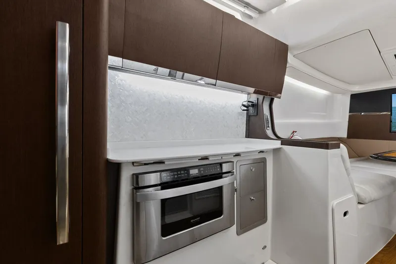  Yacht Photos Pics 2023 Grady-White Canyon 456 interior with modern kitchen and sleek cabinetry.