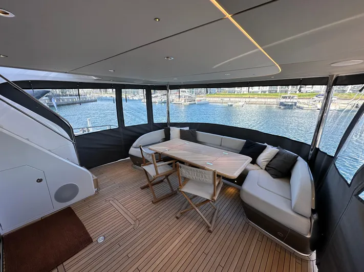  Yacht Photos Pics Luxurious 2025 Princess Y80 yacht interior with elegant seating and scenic marina view.