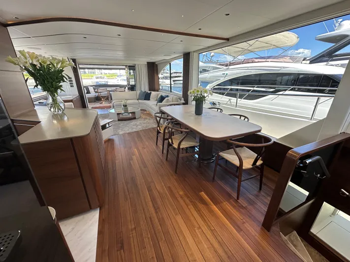  Yacht Photos Pics Luxurious interior of 2025 Princess Y80 yacht with elegant dining and seating area.