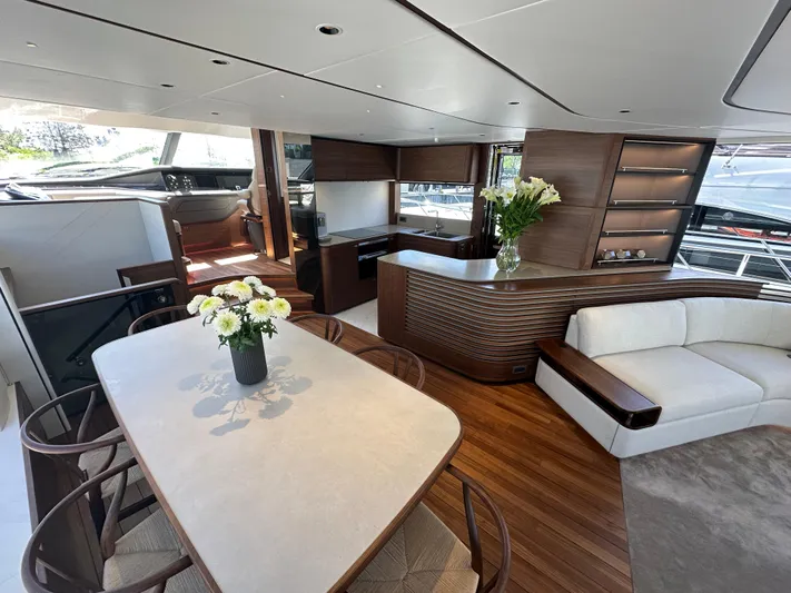  Yacht Photos Pics Luxurious interior of 2025 Princess Y80 yacht with elegant dining and seating area.