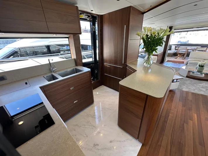  Yacht Photos Pics Luxurious interior of 2025 Princess Y80 yacht with modern kitchen and elegant decor.