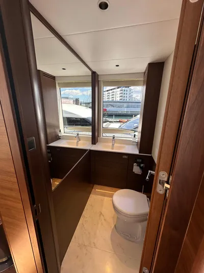  Yacht Photos Pics Luxurious bathroom on 2025 Princess Y80 yacht with dual sinks and modern fixtures.