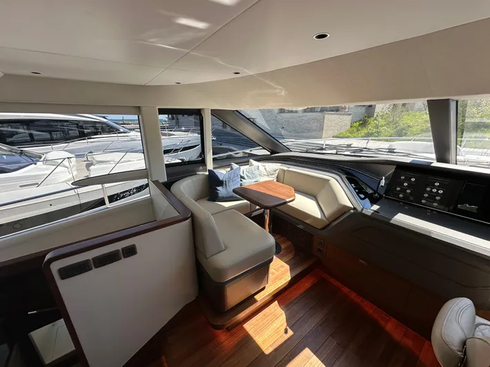  Yacht Photos Pics Luxurious interior of 2025 Princess Y80 yacht with modern seating and navigation area.