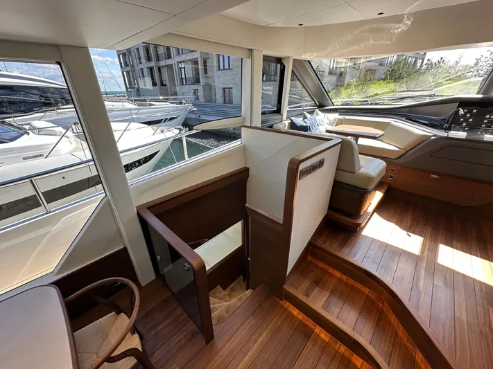  Yacht Photos Pics Luxurious interior of 2025 Princess Y80 yacht with wooden flooring and modern design.