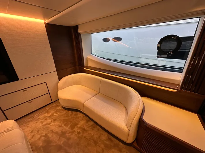  Yacht Photos Pics Luxurious interior of 2025 Princess Y80 yacht with elegant seating and large window view.