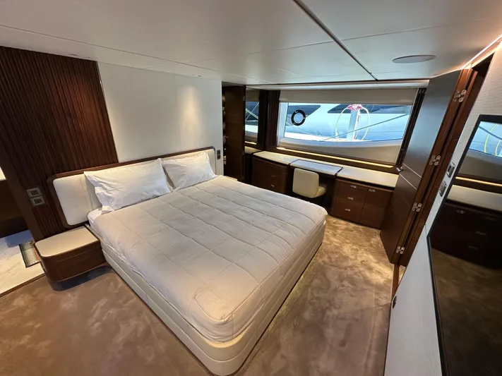  Yacht Photos Pics Luxurious bedroom interior of 2025 Princess Y80 yacht with modern design and large window.