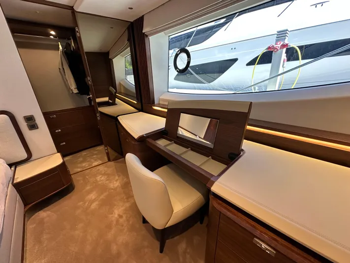  Yacht Photos Pics Luxurious interior of 2025 Princess Y80 yacht with elegant furnishings and large window view.