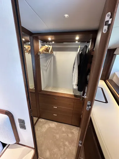  Yacht Photos Pics Luxurious Princess Y80 2025 yacht interior with elegant wooden wardrobe and modern design.
