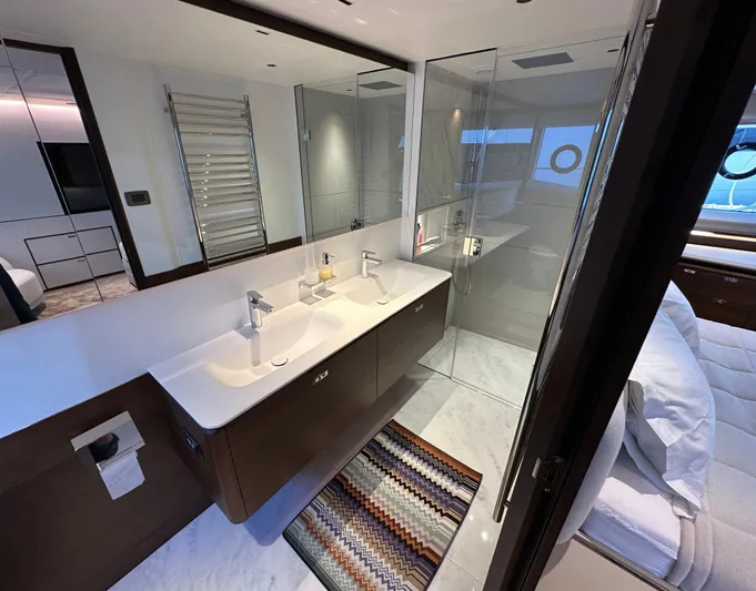  Yacht Photos Pics Luxurious bathroom in 2025 Princess Y80 yacht with dual sinks and glass shower.