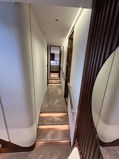  Yacht Photos Pics Luxurious hallway inside 2025 Princess Y80 yacht, featuring elegant lighting and modern design.
