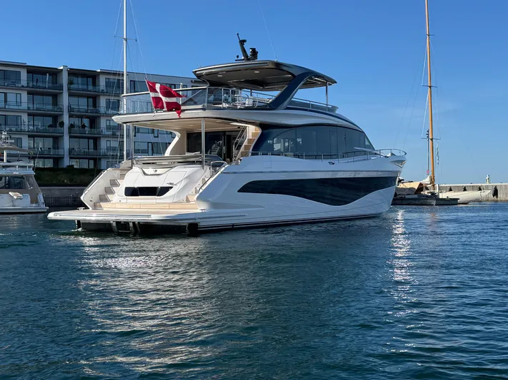  Yacht Photos Pics 2025 Princess Y80 yacht docked in marina, featuring sleek design and modern architecture.