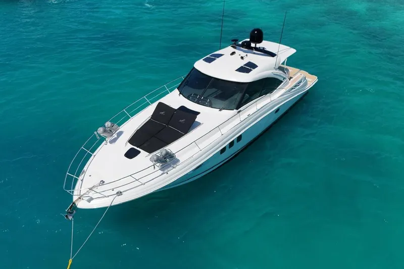  Yacht Photos Pics 2006 Sea Ray 480 Sundancer yacht on clear turquoise water, aerial view.