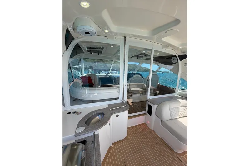  Yacht Photos Pics Luxurious interior of 2006 Sea Ray 480 Sundancer yacht with elegant seating and ocean view.
