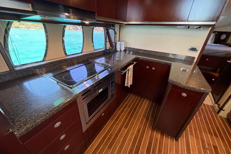  Yacht Photos Pics Luxurious kitchen interior of 2006 Sea Ray 480 Sundancer yacht with ocean view.