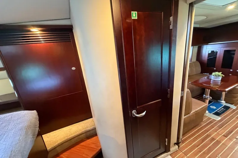  Yacht Photos Pics Luxurious interior of 2006 Sea Ray 480 Sundancer yacht with wood finishes and seating area.