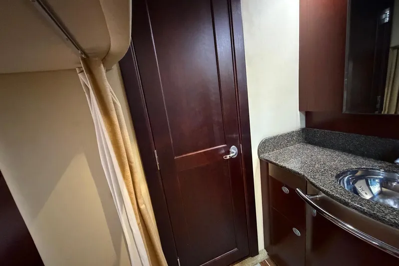  Yacht Photos Pics Interior of 2006 Sea Ray 480 Sundancer yacht with wooden door and granite countertop.