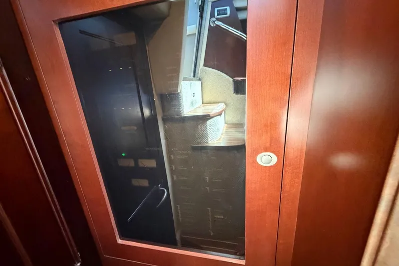  Yacht Photos Pics Interior view of 2006 Sea Ray 480 Sundancer yacht with wooden cabinetry.