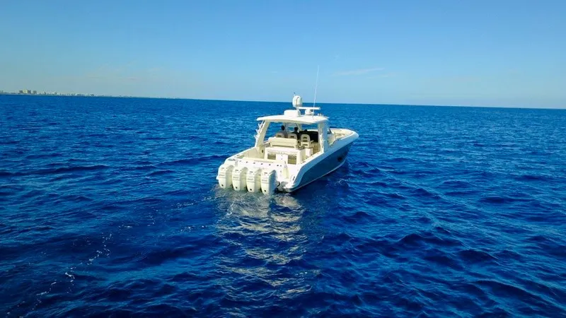  Yacht Photos Pics 2019 Boston Whaler 420 Outrage cruising on open blue sea.