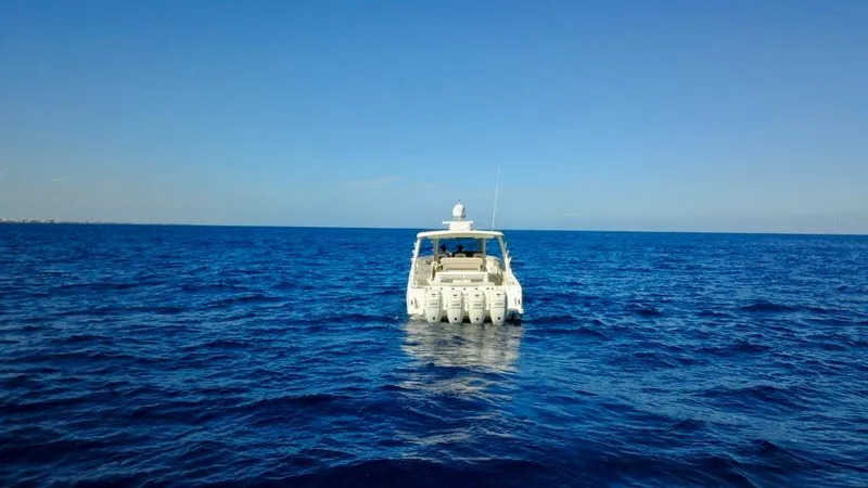  Yacht Photos Pics 2019 Boston Whaler 420 Outrage on open sea under clear blue sky.