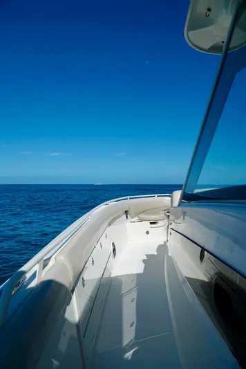  Yacht Photos Pics 2019 Boston Whaler 420 Outrage boat on open sea under clear blue sky.