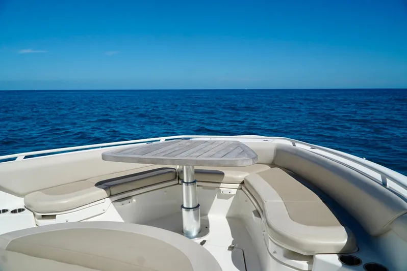  Yacht Photos Pics 2019 Boston Whaler 420 Outrage boat interior with seating and table, ocean view.