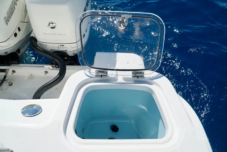  Yacht Photos Pics 2019 Boston Whaler 420 Outrage livewell with open lid, ocean background.